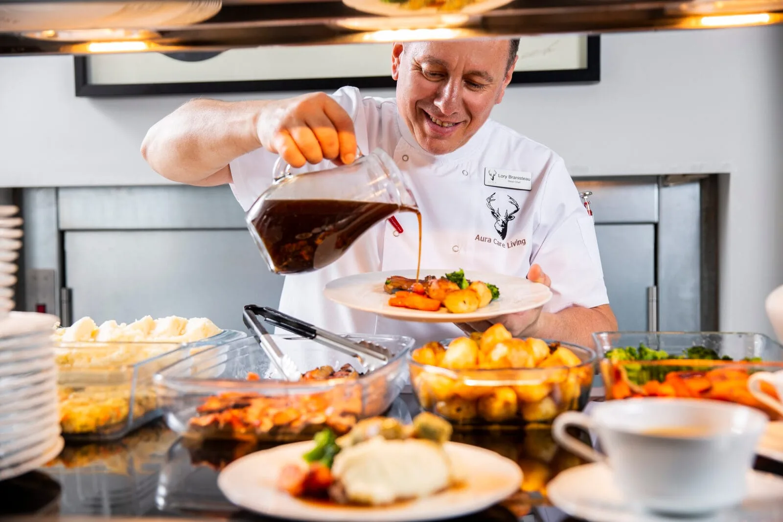 A Kings Lodge chef plating up a roast dinner