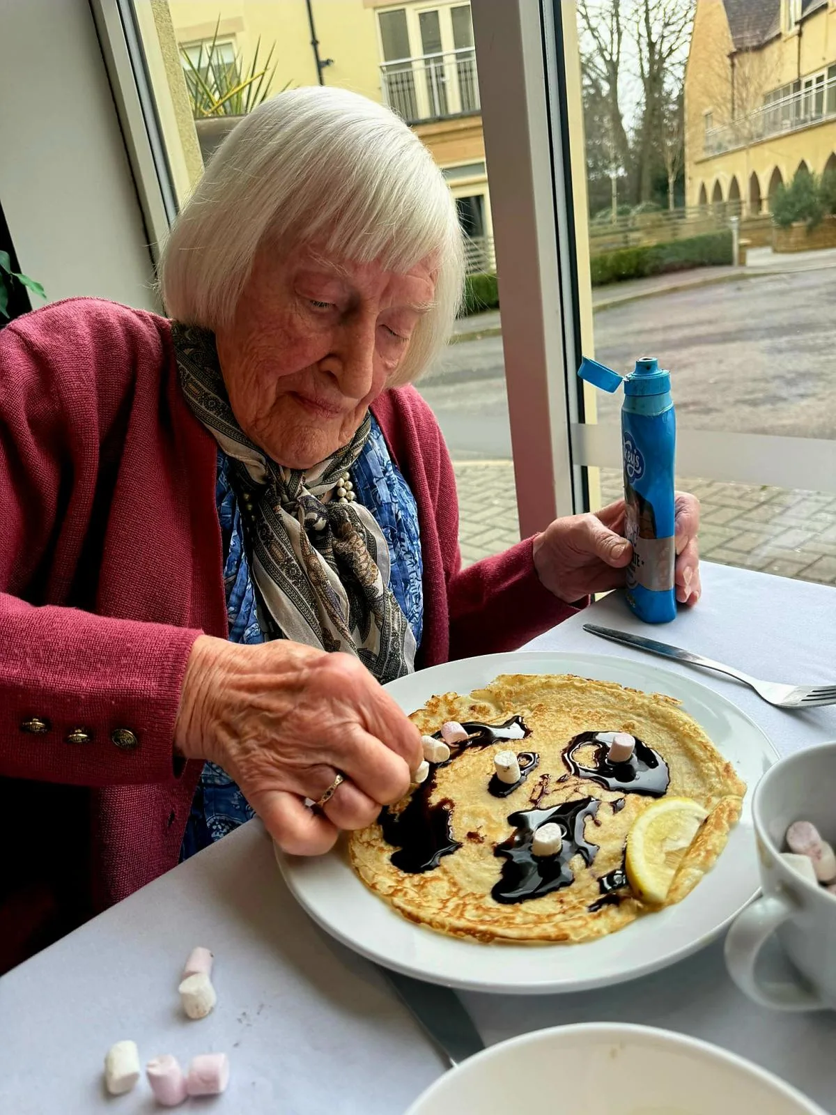 Margaret applies the finishing touches to her pancake